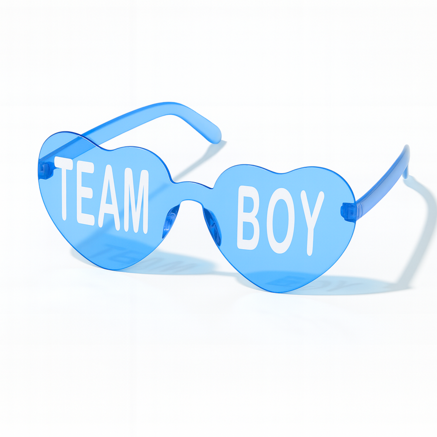 Blue heart-shaped Team Boy glasses for gender reveal or baby shower party decorations, displayed on a white background.