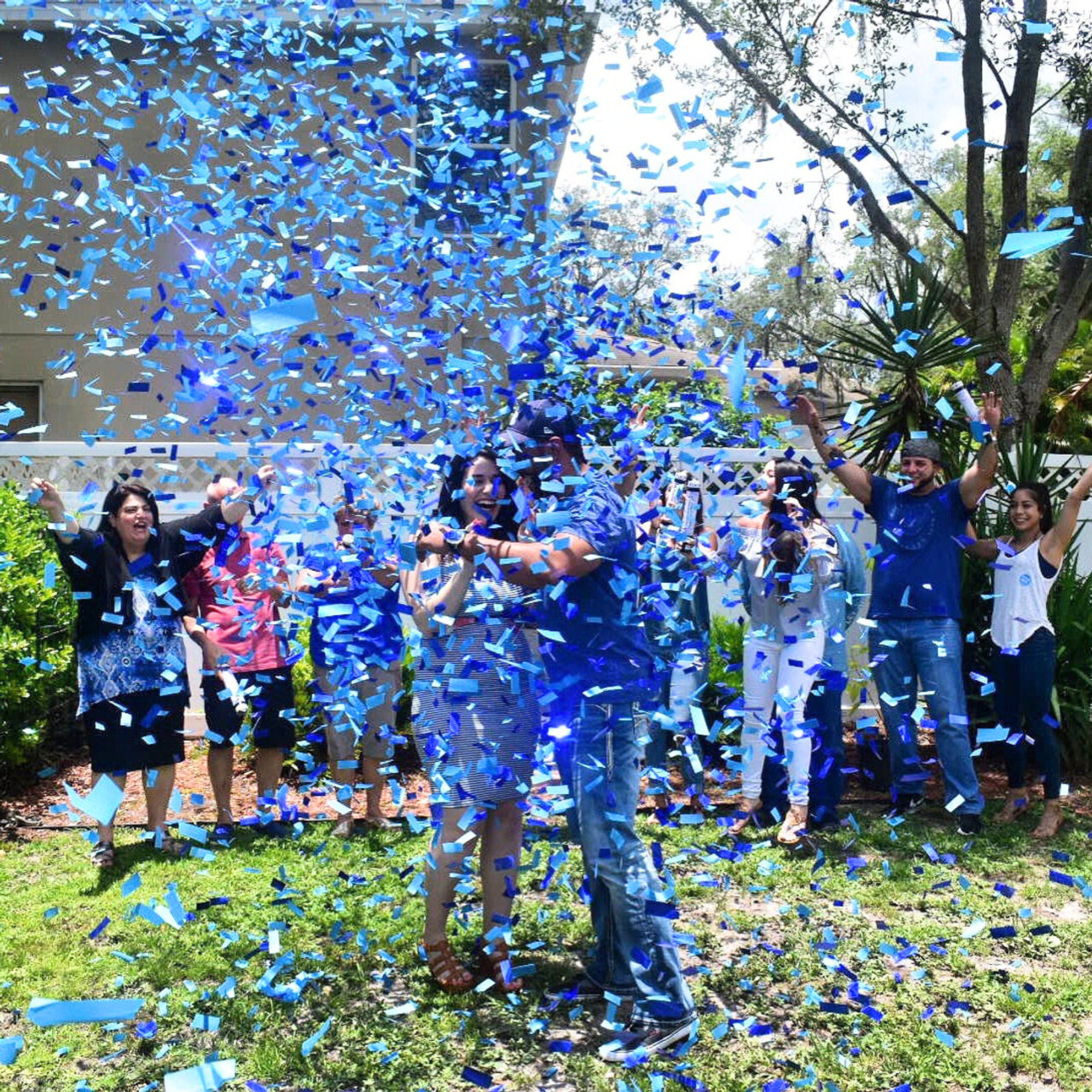 Gender Reveal Celebration with Blue Confetti Cannon