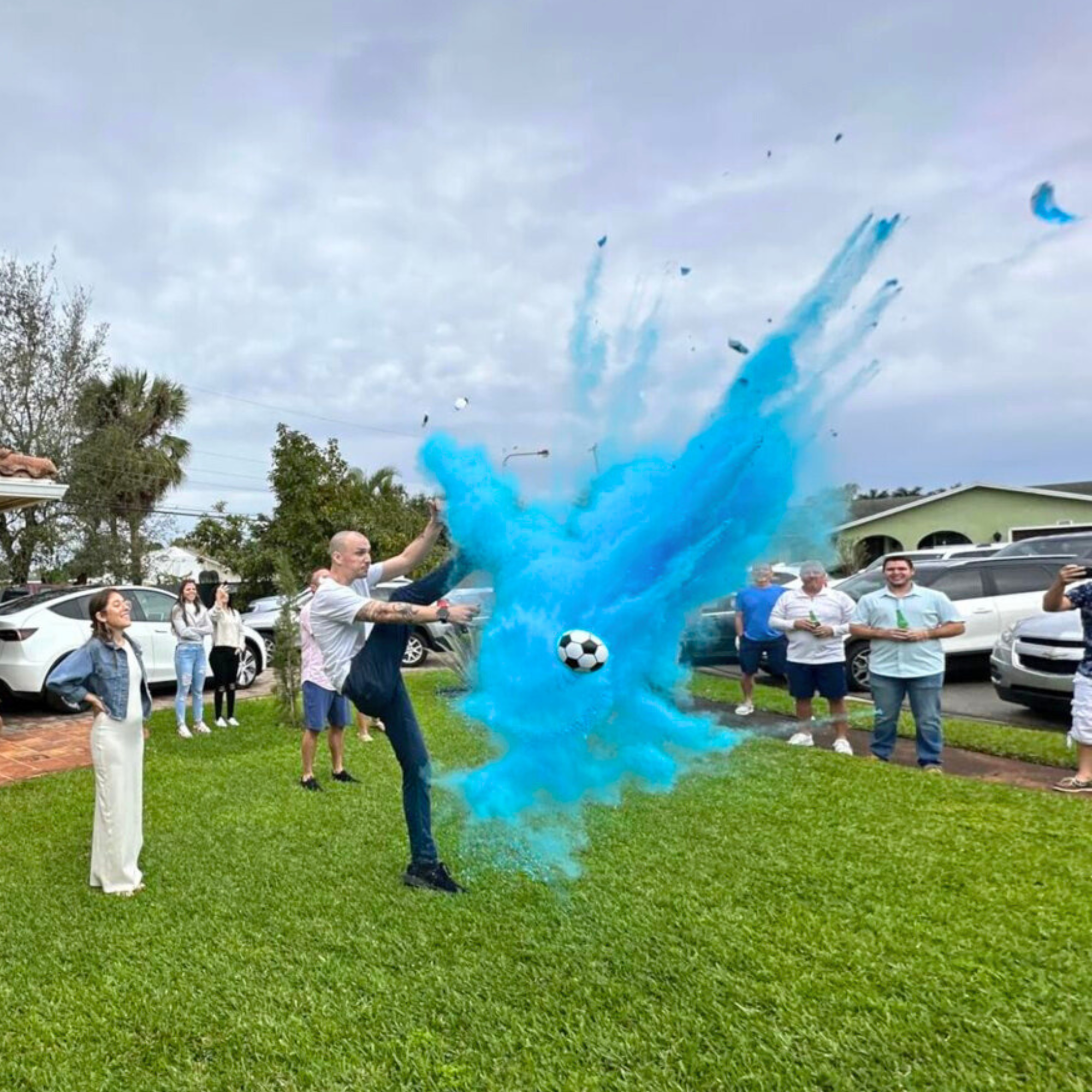 Gender Reveal Blue Soccer Ball with blue powder kick for boy gender reveal party event with family and friends
