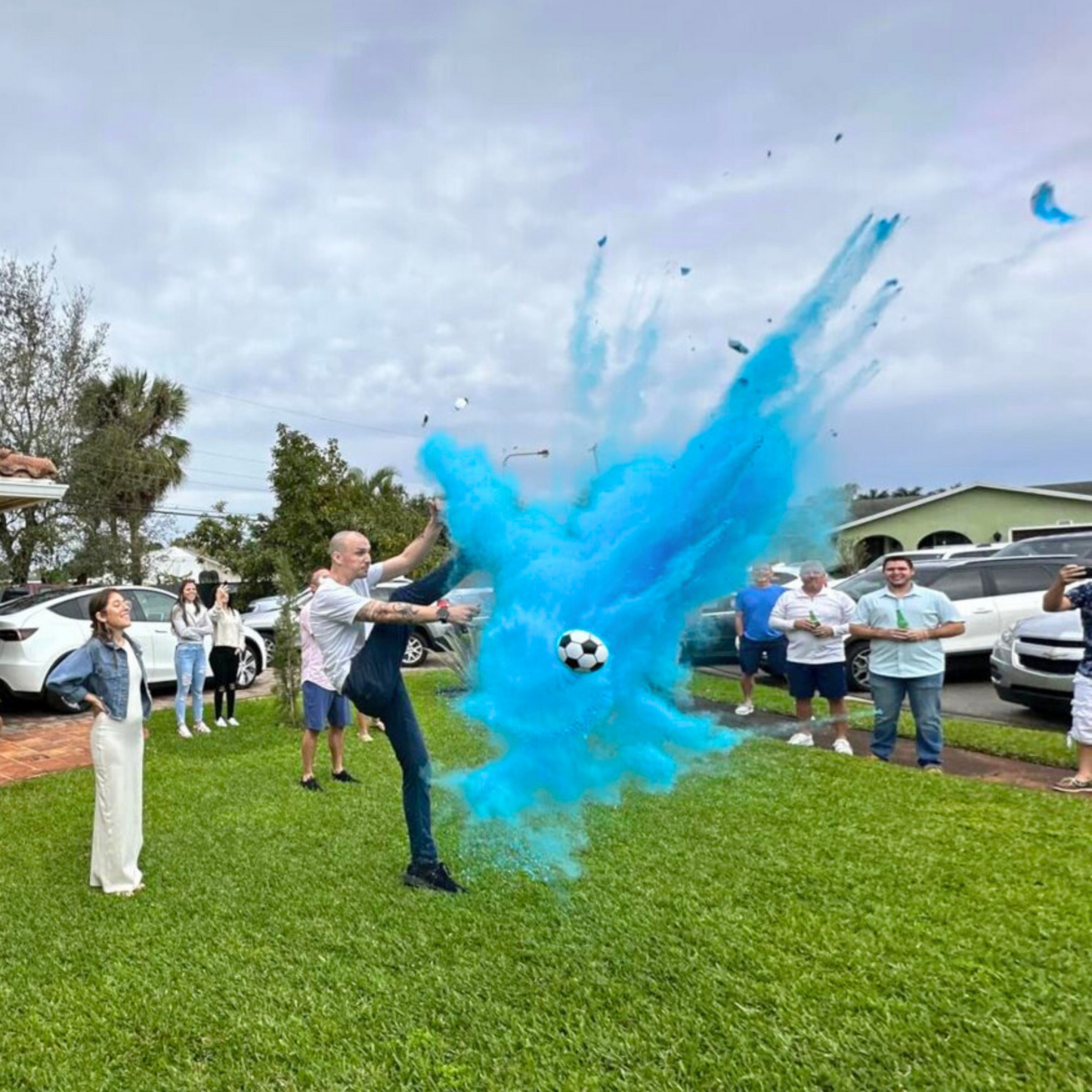 Gender Reveal Blue Soccer Ball with blue powder kick for boy gender reveal party event with family and friends